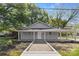 Charming single-story home with a covered front porch and manicured landscaping at 4304 S Falls St, Gastonia, NC 28056
