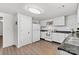 Bright kitchen with white cabinets, subway tile backsplash, and modern appliances at 4304 S Falls St, Gastonia, NC 28056