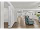 Bright living room with hardwood floors, a ceiling fan, and comfortable seating at 4304 S Falls St, Gastonia, NC 28056
