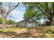Exterior view of a gray home with a white door, siding, and concrete patio at 4304 S Falls St, Gastonia, NC 28056