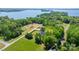 Aerial view displays stunning homes with lush lawns and greenery near a tranquil lake and expansive land at 4377 Kiser Island Rd, Terrell, NC 28682