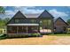 Stunning home exterior featuring a screened porch, modern siding, and large windows at 4377 Kiser Island Rd, Terrell, NC 28682