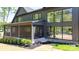 Beautiful home exterior with large windows, a screened porch, and a well-maintained lawn at 4377 Kiser Island Rd, Terrell, NC 28682