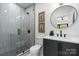 Bright bathroom featuring a modern shower and sleek vanity at 4377 Kiser Island Rd, Terrell, NC 28682
