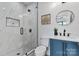 This bathroom features a modern glass shower, and a sleek blue vanity at 4377 Kiser Island Rd, Terrell, NC 28682