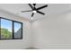 Bedroom featuring a ceiling fan, large window with lots of natural light, and hardwood flooring at 4377 Kiser Island Rd, Terrell, NC 28682