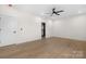 Light-filled bedroom boasts hardwood flooring, a ceiling fan, and white trim around doors and openings at 4377 Kiser Island Rd, Terrell, NC 28682