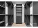 Walk-in closet featuring custom shelving, drawers, and modern design at 4377 Kiser Island Rd, Terrell, NC 28682