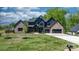 Stunning two-story home showcasing modern design, lush lawn, and a spacious driveway at 4377 Kiser Island Rd, Terrell, NC 28682