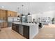 Large kitchen featuring a spacious island with white countertops, stainless steel appliances, and modern fixtures at 4377 Kiser Island Rd, Terrell, NC 28682