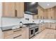 Well-appointed kitchen with stainless steel appliances, black countertops, and light wood cabinets at 4377 Kiser Island Rd, Terrell, NC 28682