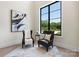 Bright sitting area with two chairs and a large window offering ample natural light at 4377 Kiser Island Rd, Terrell, NC 28682