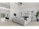 Spacious living room with high ceilings, fireplace, built-in shelves, and light hardwood floors at 4377 Kiser Island Rd, Terrell, NC 28682