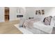 Cozy primary bedroom with hardwood floors, electric fireplace, and neutral decor at 4377 Kiser Island Rd, Terrell, NC 28682