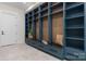 Spacious mudroom with built-in blue shelving, drawers, and bench with elegant marble countertop at 4377 Kiser Island Rd, Terrell, NC 28682