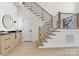 Modern staircase design featuring wood stairs, black metal railings, and light wood accents at 4377 Kiser Island Rd, Terrell, NC 28682