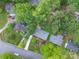 Overhead view of home showing mature trees, lush landscaping, and a long driveway at 4920 Raymond Pl, Charlotte, NC 28205