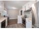 Well-lit kitchen featuring stainless steel appliances, wood countertops, and a tile backsplash at 4920 Raymond Pl, Charlotte, NC 28205