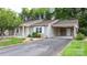Inviting exterior showcasing the home's manicured lawn, private driveway, and attached carport at 505 2Nd Street Ne Pl # C4, Conover, NC 28613