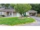 Charming home featuring a lush lawn, complemented by a decorative tree and a convenient carport at 505 2Nd Street Ne Pl # C4, Conover, NC 28613