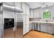 Kitchen featuring stainless steel appliances, modern cabinets, natural light, and beautiful wood flooring at 505 2Nd Street Ne Pl # C4, Conover, NC 28613