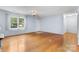 Spacious living room with hardwood floors, ceiling fan and natural light with large windows at 505 2Nd Street Ne Pl # C4, Conover, NC 28613