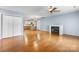 Bright living room featuring hardwood floors, a fireplace, and a view into the kitchen at 505 2Nd Street Ne Pl # C4, Conover, NC 28613