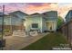 Backyard view showcasing outdoor seating, lighting and an outdoor television for entertaining at 507 E Main St, Rock Hill, SC 29730