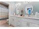 This bathroom features a double vanity with stylish lighting, and updated fixtures at 507 E Main St, Rock Hill, SC 29730