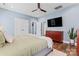 This bedroom features stylish ceiling fan, hardwood floors, and a flat-screen TV at 507 E Main St, Rock Hill, SC 29730