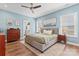 Relaxing primary bedroom with a ceiling fan, hardwood floors, and ample natural light at 507 E Main St, Rock Hill, SC 29730