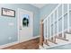 Bright entryway with wood floors, staircase, and a view of the front door at 507 E Main St, Rock Hill, SC 29730