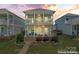 Inviting two-story home featuring double porches and manicured landscaping at 507 E Main St, Rock Hill, SC 29730