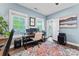 Bright home office with comfortable seating, multiple work stations, and stylish rug at 507 E Main St, Rock Hill, SC 29730