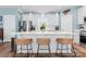 Modern kitchen island with seating, white cabinetry, and stainless steel appliances at 507 E Main St, Rock Hill, SC 29730