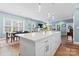 Open-concept kitchen with large island, modern lighting, and stainless appliances at 507 E Main St, Rock Hill, SC 29730