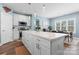 Stylish kitchen with large island, white cabinets, and dining area views at 507 E Main St, Rock Hill, SC 29730