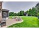 Expansive backyard with patio, fire pit, playground, and lush green lawn at 525 Chase Prairie Ln, Waxhaw, NC 28173