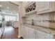 Stylish bar area with granite countertops, wine rack, and elegant cabinetry at 525 Chase Prairie Ln, Waxhaw, NC 28173