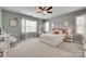 Bright bedroom with neutral walls, white trim, and a large window at 525 Chase Prairie Ln, Waxhaw, NC 28173