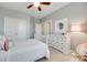 Bedroom showcases a ceiling fan, a large mirror on the wall, and neutral-colored walls at 525 Chase Prairie Ln, Waxhaw, NC 28173