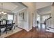 Spacious entryway featuring hardwood floors, wainscoting, and views into the dining and living areas at 525 Chase Prairie Ln, Waxhaw, NC 28173