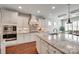 Bright kitchen featuring granite countertops, custom cabinets, and stainless steel appliances at 525 Chase Prairie Ln, Waxhaw, NC 28173