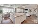 Open-concept kitchen with granite countertops, stainless steel appliances, and an eat-in area at 525 Chase Prairie Ln, Waxhaw, NC 28173