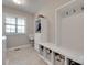 Mudroom featuring built-in shelving for storage and a utility sink, complete with natural light at 525 Chase Prairie Ln, Waxhaw, NC 28173