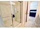 Clean bathroom featuring glass shower with chrome doors, a neutral color scheme and access to main bedroom at 525 San Marco Dr, Gastonia, NC 28056