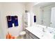 Clean bathroom with modern fixtures, including a sleek vanity, toilet, and a white cabinet for extra storage at 525 San Marco Dr, Gastonia, NC 28056