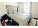 Bright bedroom with a tufted headboard, stylish bedding, and a window that provides natural light at 525 San Marco Dr, Gastonia, NC 28056