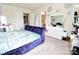 Bright bedroom with modern furniture, including a large white dresser and a plush, blue velvet-covered bed at 525 San Marco Dr, Gastonia, NC 28056