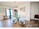Dining area with a glass table and modern chairs by bright windows at 525 San Marco Dr, Gastonia, NC 28056